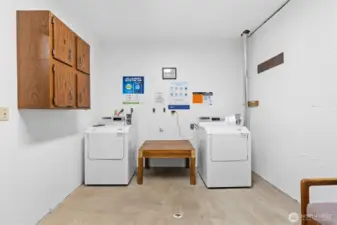 The laundry room is located on the lower level with coin-op and are leased machines.