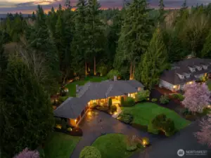 Sprawling Estate on shy acre lot. Lined with mature trees & native landscaping.