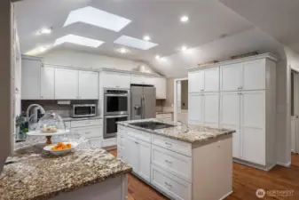 Updated kitchen with granite counters & newer appliances. Plenty of storage & pantry space.