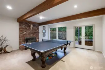 Lower level rec room with gas fireplace & separate exit to lower deck with hot tub.