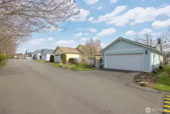 Looking at the home from Applewood Dr which brings you right to the attached 2-vehicle garage and additional parking.
