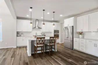 Super spacious kitchen accommodates exceptionally well with TONS of cabinets, yards of counter space and many upgrades to finishes, including cabinet crown molding to "finish out" the top of the cabinets in style.