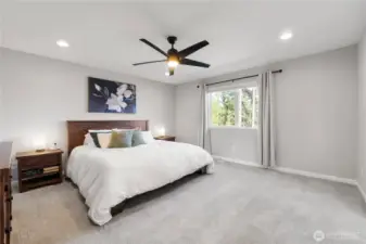 Just part of the truly sweet primary suite. Spacious enough for a lounge chair, several dressers and more!