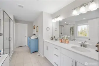 Huge, five piece primary bath shines with massive mirror coverage and so much counter-space!