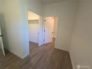 From Primary bedroom, doors to walk in closet and primary bath