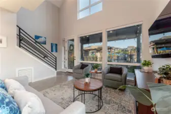 View 4 of the Great Room/Living Room w/ vaulted ceilings, oversized windows and doors leading to the outdoor living area.