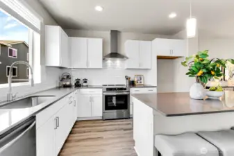 Homesite #2 kitchen with Offshore Mist color sheme offering subtle contrast and classic nuetrals. Abundance of cabinets and counter top space for entertaining, storage and meal prep.