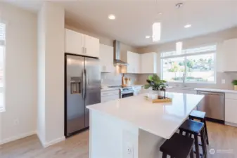 Image of Homesite #1 kitchen offering white cabinets & white quartz.