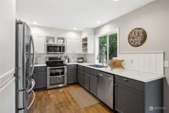 Painted cabinets, stainless appliances, undated paint.