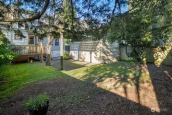 Back yard looking toward house, patio & garage