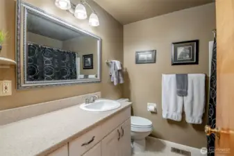 Hall bath provides large vanity and a shower/bath combo