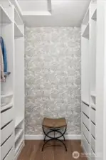 Walk in closet with built in hanging and drawers