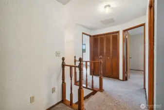 Upper level landing and stairway to main floor
