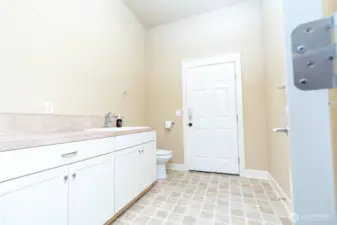 1/4 bath off garage, back door leads to back yard.