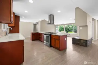 Kitchen with all newer kitchen Quartz counters and large island with breakfast bar