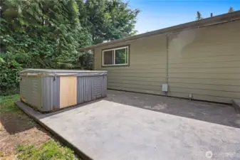 Large patio with hot tub