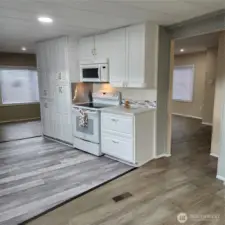 Kitchen with peek a boo of living room