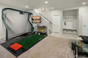 Sitting area just inside garage, perfect for shoes & coats