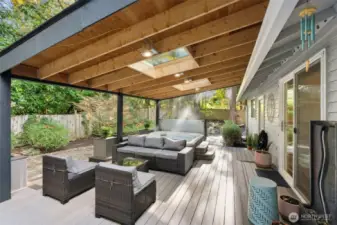 Large covered entertaining deck with a relaxing hot tub