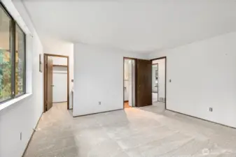 Primary Suite: Large window overlooks private treed setting & back yard