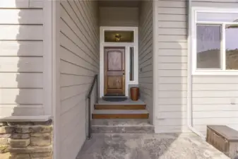 Covered entry porch protected from elements.