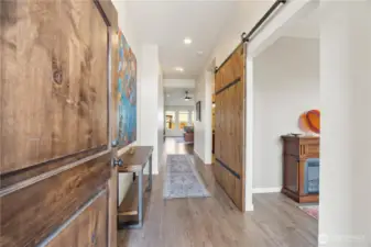 Light bright entry hallway 9' ceilings leads into the vaulted open great room with wood burning fireplace.