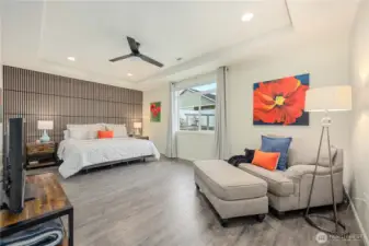 Oversized Primary suite with seating area and tons of natural light.