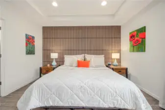 Oversized Primary suite with seating area and tons of natural light.