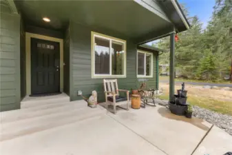 Welcoming poured concrete patio entry.