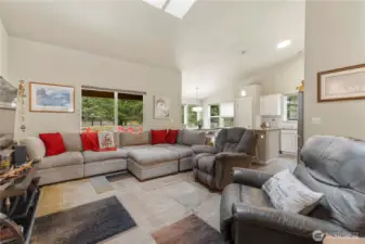 Living, dining and kitchen areas feature vaulted ceiling and skylights.  This home is bright even on the most overcast days.