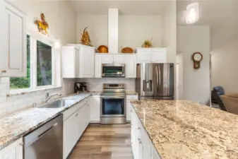 Stainless steel appliances, handsome cabinetry & granite countertops are some of the many upgrades in this mountain home.