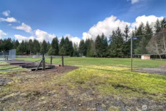 Ball field, horseshoe pits with horse corral in far background at HOA complex on Meadow Way.