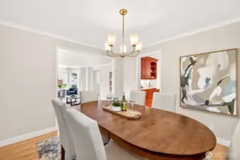 Designed for easy entertaining, the dining room connects naturally to both the living area and kitchen, creating a comfortable layout for gatherings and everyday meals.