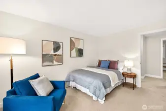 Another view of the second versatile upstairs bedroom highlights the abundance of usable wall space and an easy layout, complemented by the quiet feel that comes with upgraded wood core doors.