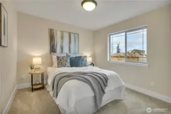 Main-floor bedroom with generous closet.  Next door to 3/4 bath.  NEW carpeting & paint!