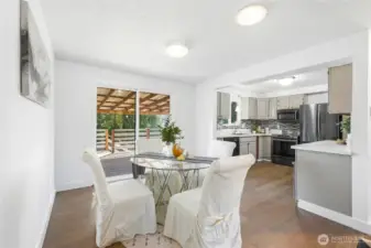 The dining area is well-positioned within the home, offering an easy flow for both daily meals and gatherings. Natural light enhances the space, making it feel open and inviting.