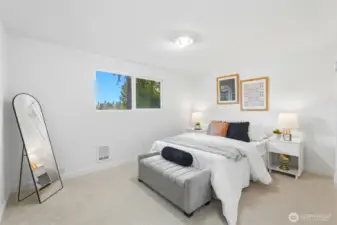 The main bathroom has been tastefully refreshed to reflect a more modern aesthetic. A new vanity provides both style and practical storage. The updated mirror enhances the space, adding a clean and polished look.