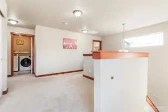 View of loft and laundry from the top of the staircase