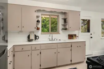 Kitchen looks over back yard