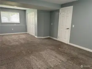 Downstairs bonus room/second primary bedroom.