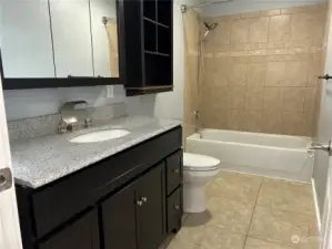 Downstairs bathroom. One of three full bathrooms in the home.