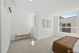Primary suite with sitting area! Model home. Colors and finishes may vary.