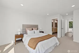 Another view of the spacious primary suite! Model home. Colors and finishes may vary.