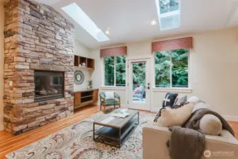 Stone fireplace anchors the room
