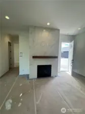 Beautiful floor to ceiling fireplace surround with mantel