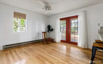 Cozy Den with french doors leading out to large deck.