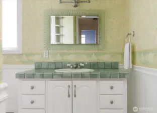 Upstairs Bathroom has bathtub shower combo.