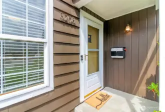 Super cute covered front porch.