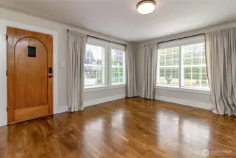 Gorgeous hardwood floors and tons of natural light! Check out that door!