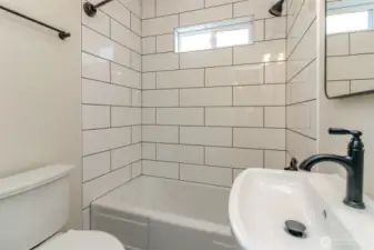 Modern main bathroom is light and bright, you're going to love it!
